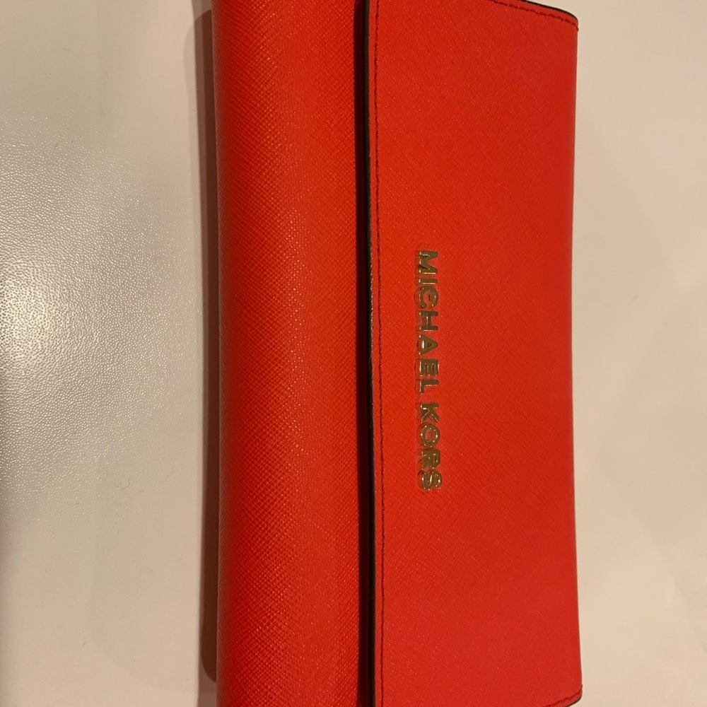 Bright red Michael Kors wallet. Like new.